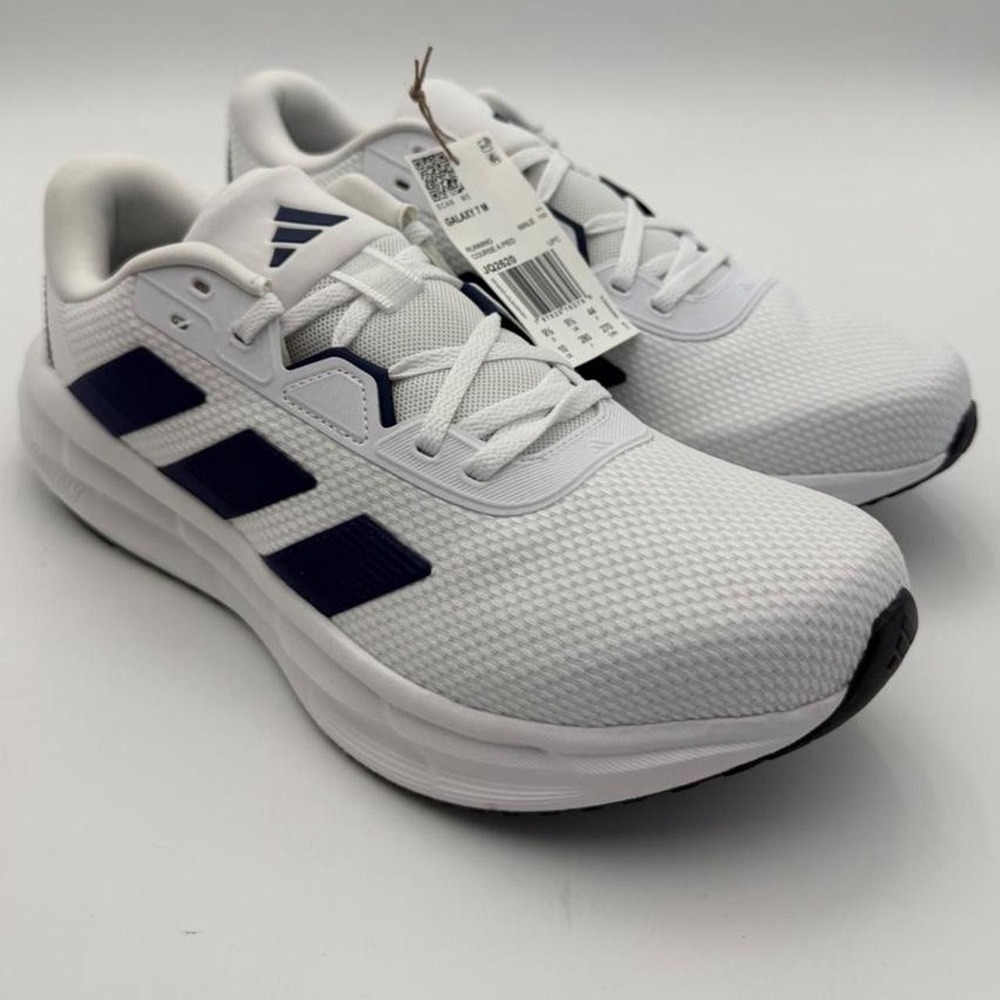 Men's size 10 Adidas Galaxy 7 white sneakers with navy blue stripes